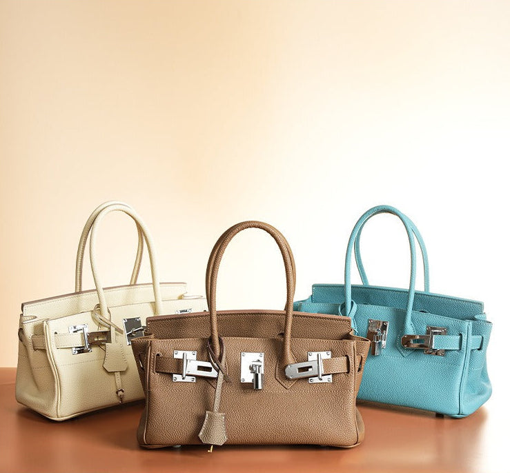 Pebbled Leather Horizontal Lock Handbag