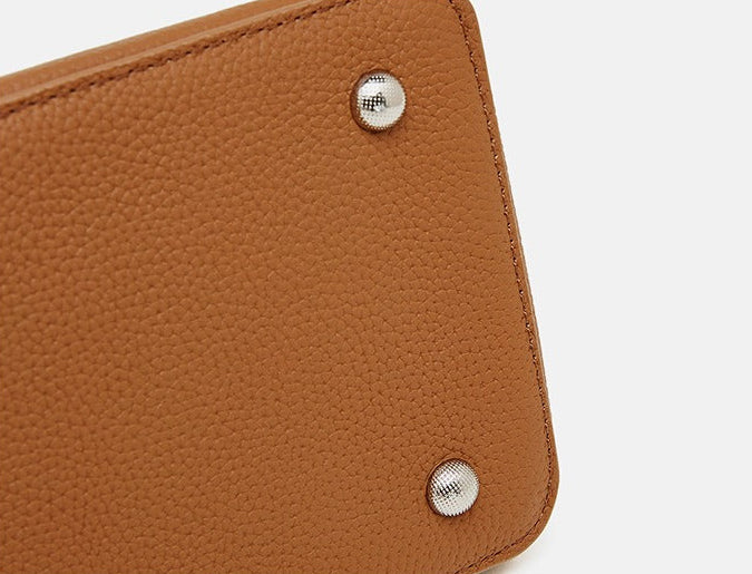 Textured Leather Twist Lock Handbag